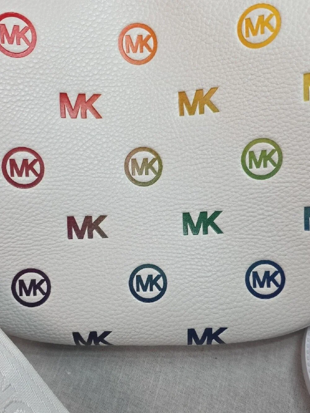 Michael Kors Slater Medium Rainbow Logo Embossed Sling Pack in Optic White